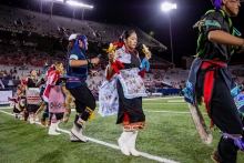 Hopi dancers performing and U of A football game